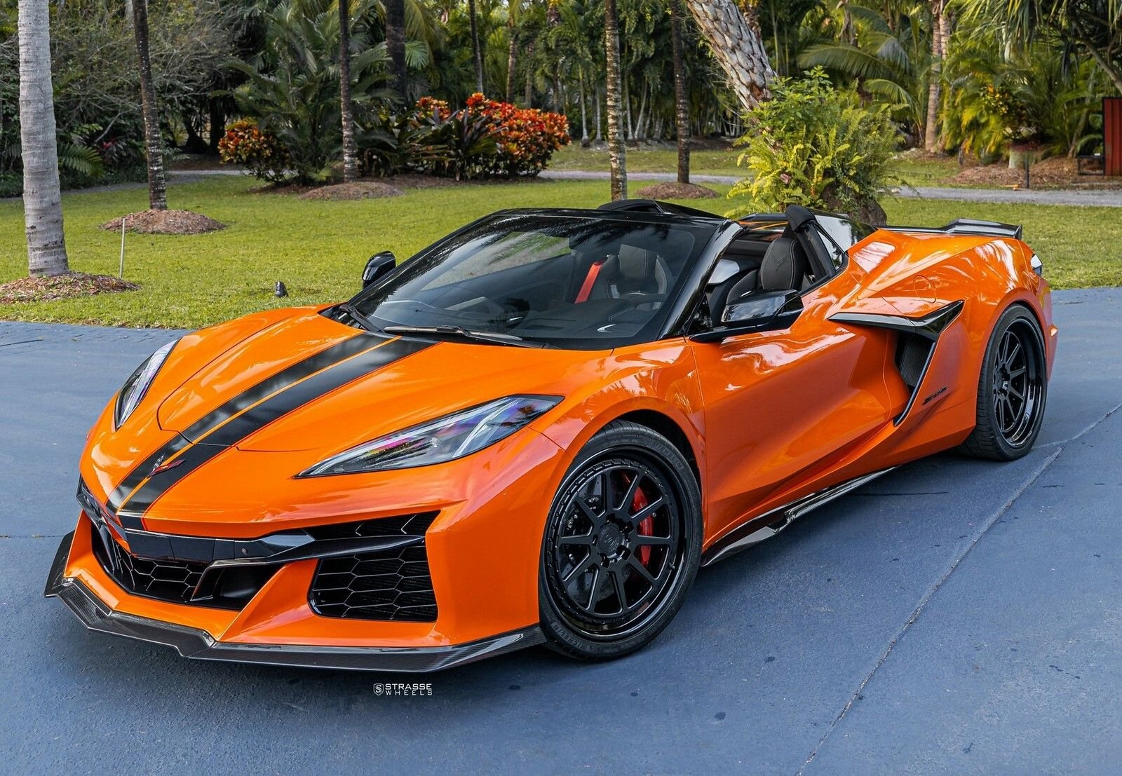 Exterior-only mobile detailing — glossy orange Corvette Z06 on a residential driveway, Round Rock Mobile Detailing